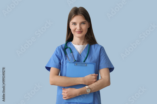 Beautiful doctor with clipb...