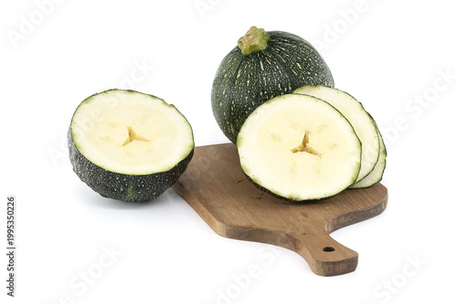 Round Zucchini Sliced on Wooden Cutting Board with Whole Globe Zucchini Fresh Green Summer Squash