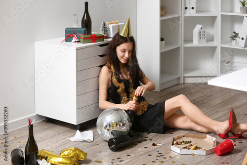 Drunk young woman opening b...