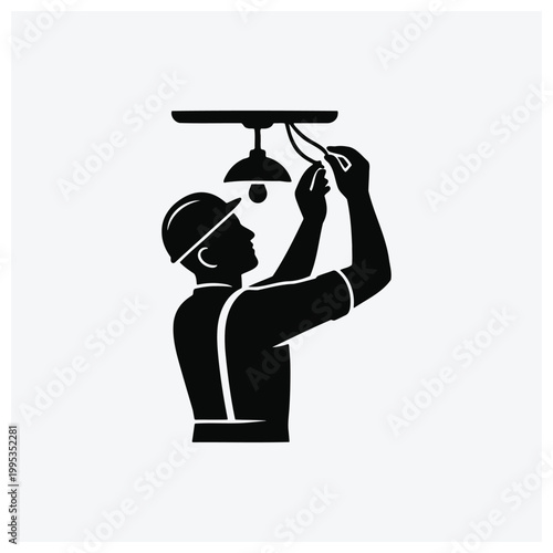 Electrician installing or repairing a ceiling light fixture