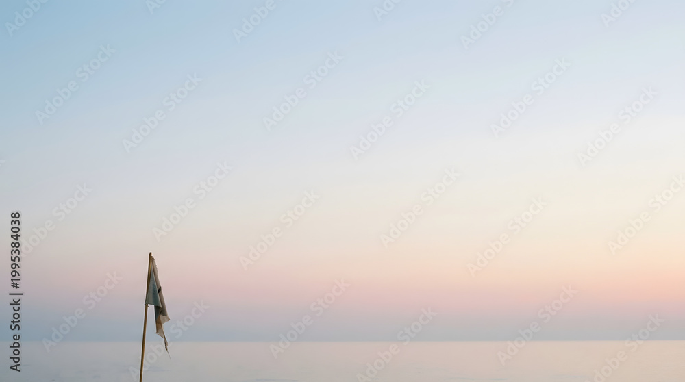 © byvea - A solitary, weathered flag stands against the vast, serene expanse of pastel sky merging with the tranquil ocean horizon, evoking profound peace and solitude © byvea - A solitary, weathered flag stands against the vast, serene expanse of pastel sky merging with the tranquil ocean horizon, evoking profound peace and solitude