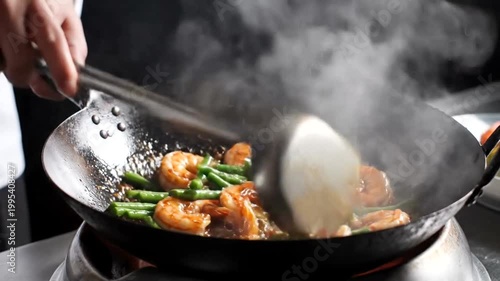 Chef skillfully stir-frying shrimp and green beans in a hot wok, steam rising, kitchen backdrop