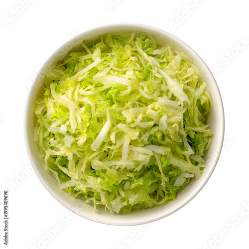 Fresh shredded cabbage in white bowl on neutral background for healthy cooking