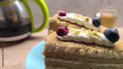 Honey-almond layered cake with berries on top
