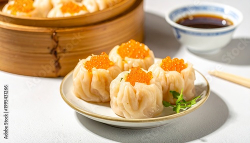 Plump steamed crab dumplings topped with vibrant orange roe, served on a white plate with dipping sauce