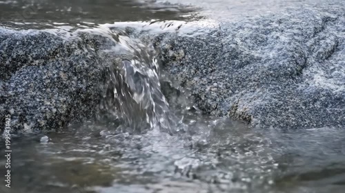 Close-up of Water Flowing Over Rocks in a Stream.