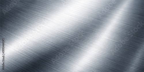 Shiny silver brushed metal texture background with a polished stainless steel plate pattern featuring a gray metallic aluminum surface and chrome light reflections for an industrial material wallpaper