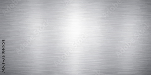 Polished silver stainless steel plate with a brushed metallic texture featuring a shiny industrial grey aluminum surface pattern on a sleek chrome alloy material backdrop