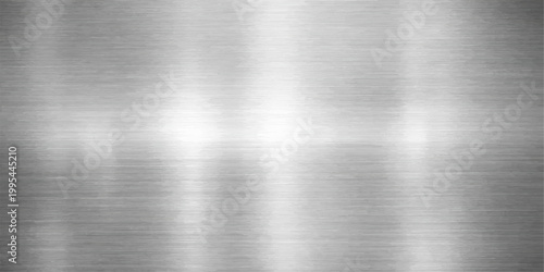 Polished stainless steel plate with a brushed metal texture featuring a shiny silver metallic surface and industrial grey aluminum pattern for a sleek backdrop design