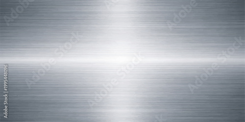 Polished silver stainless steel plate with a brushed metal texture featuring a shiny metallic pattern on a light grey aluminum surface for a sleek industrial backdrop