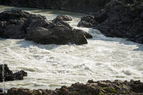 rocky rapids of a mountain river, strong current