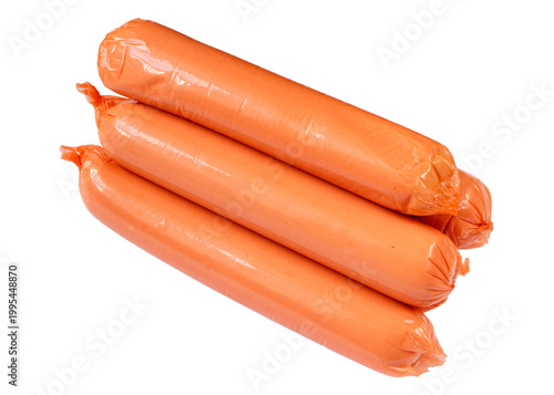 A pile of thin sausages isolated on a white background. A lot of meat sausages close-up.