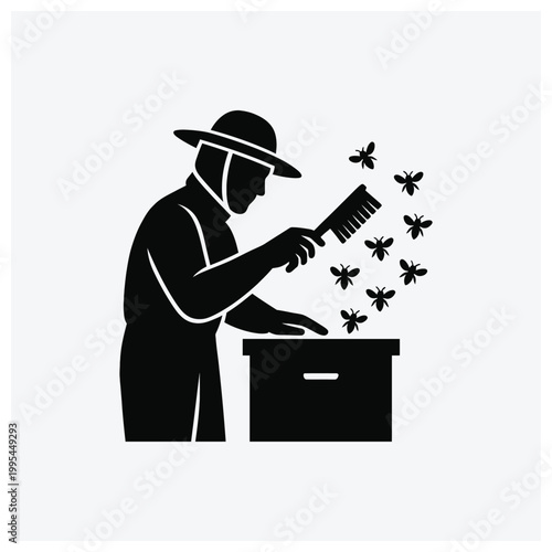 Silhouette of a beekeeper sweeping bees from a hive