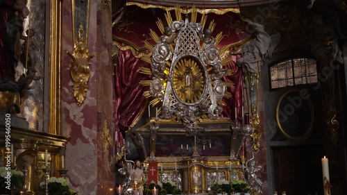 Interior of the Asam Church in Munich with golden altar and ornate Rococo decorations, St. Nepomuk