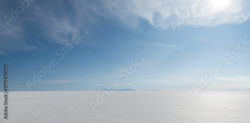 Serene blue sky over vast salt flat landscape in Uyuni Bolivia