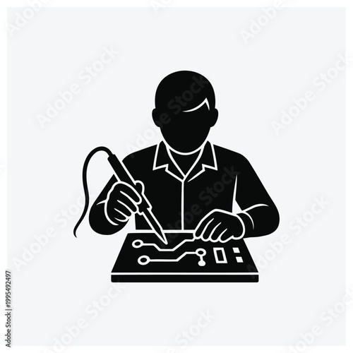 Technician soldering circuit board with electronics equipment