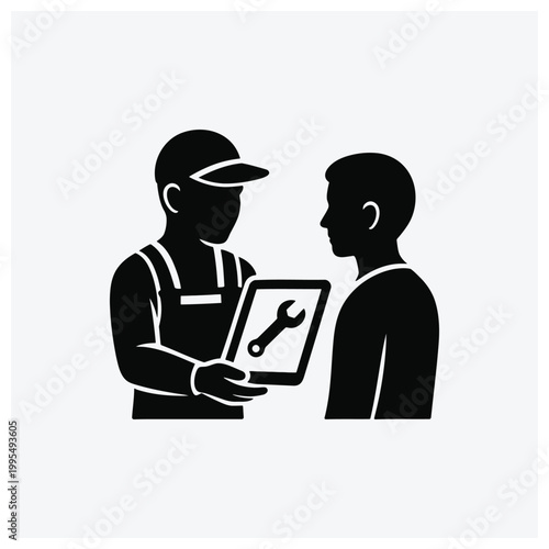 Technician and customer discussing repair service or equipment on a diagram.