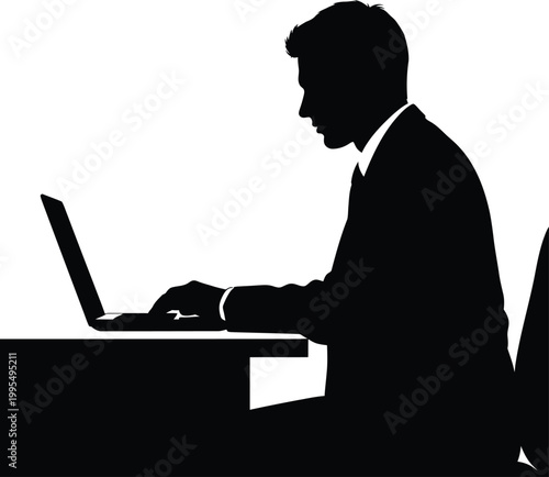 Man working on laptop at desk silhouette
