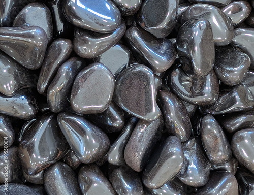 Fotografie Metallic Grey Tumbled Hematite Stones Closeup
