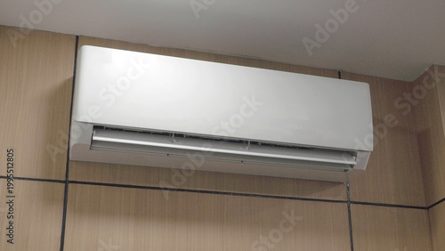 Close Up of Split System Air Conditioner Unit on Wall for Temperature Regulation and Air Quality Improvement in Residential or Commercial Building Interior