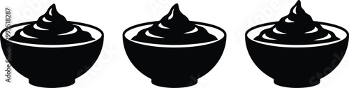 Three black bowls of whipped cream white background dessert