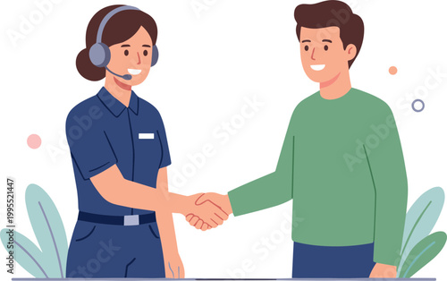 A woman in a headset shakes hands with a man in a green shirt.