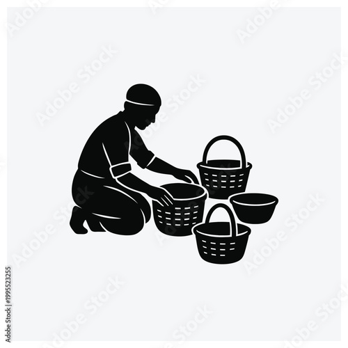 Silhouette of a worker gathering or collecting items with baskets.