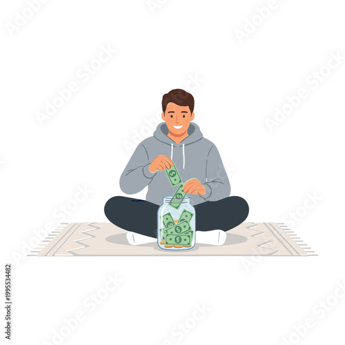 Man sitting on rug putting money into jar with bills and coins