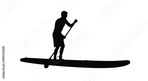 Silhouette of a person paddleboarding on calm water at sunset