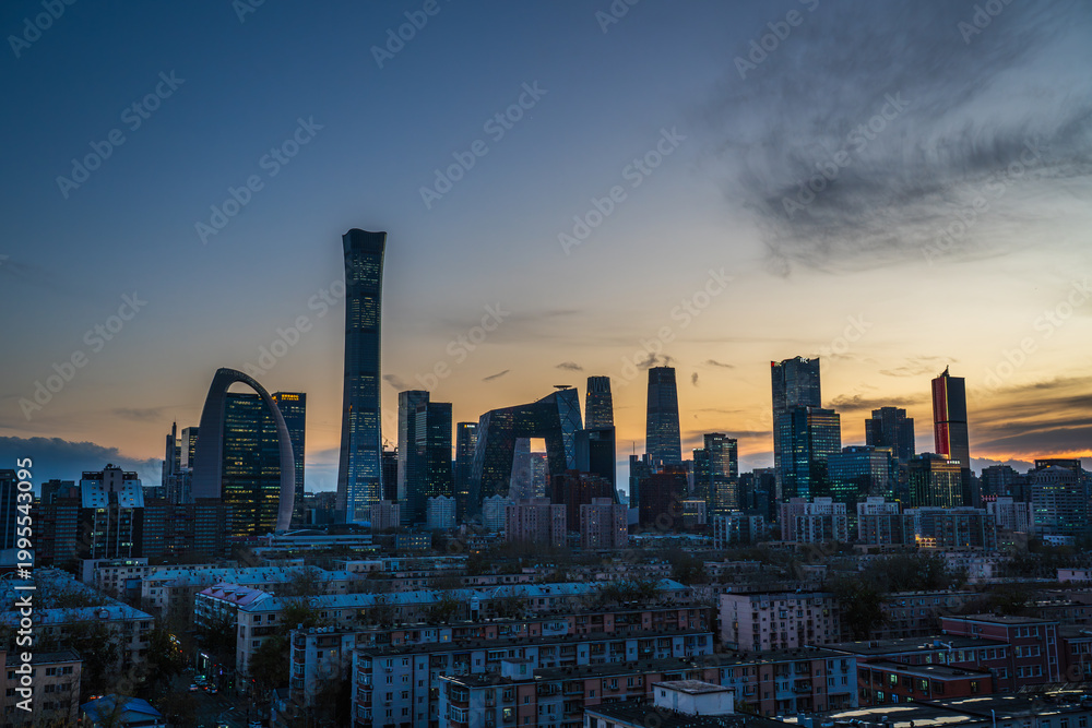 Fototapeta premium Cityscape of Beijing Central Business District (CBD) at sunset with a vibrant afterglow