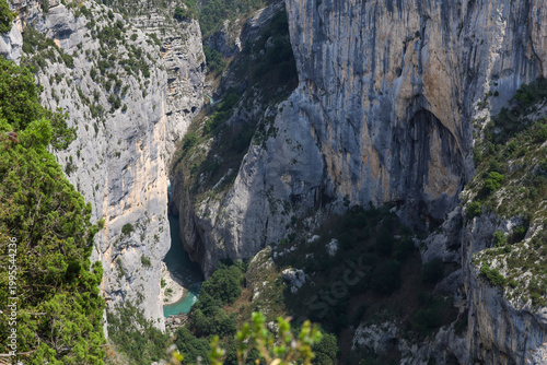 Panoramic view of the Verdon Gorge canyon and river in Provence, France. Steep limestone cliffs and turquoise river. Scenic mountain landscape of the Grand Canyon in French Alps