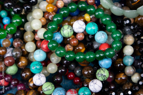 Bracelets made of jade and various gemstones are stacked up.옥과 여러가지 보석으로 만든 팔찌가 쌓여있습니다.