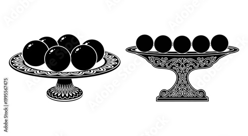 Black spheres on decorative ornate pedestal plates