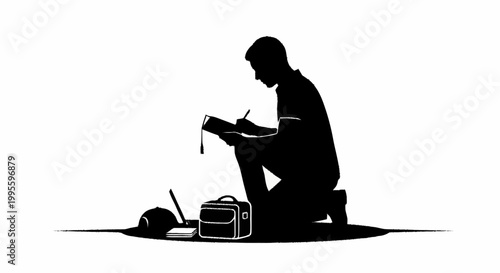 A kneeling man writing in a notebook next to his work equipment.