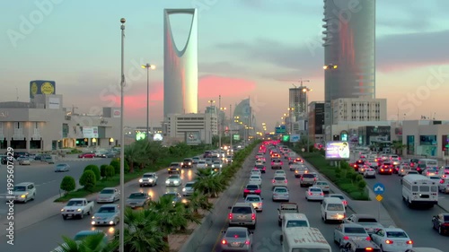 Riyadh City Skyline Aerial View Featuring Kingdom Tower and Heavy Traffic Flow on King Fahd Road, Saudi Arabia.