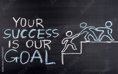 Chalk drawing of teamwork helping each other to succeed on blackboard with motivational text