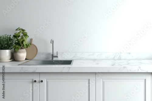 Modern kitchen sink with houseplants and cutting board on marble countertop.