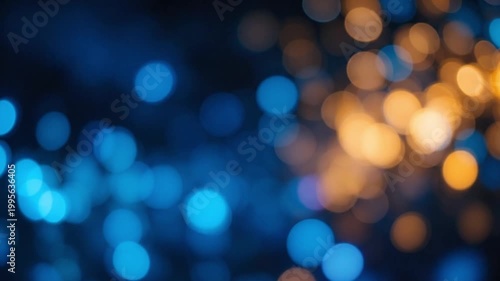 Abstract bokeh background featuring bright defocused Christmas lights with a colorful glowing blur and shiny blue sparkles for a festive holiday celebration design