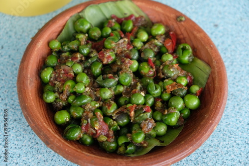 Pencok leunca is a type of shrimp paste chili sauce mixed with ranti vegetables or small black eggplants. Solanum nigrum. Indonesian food. 