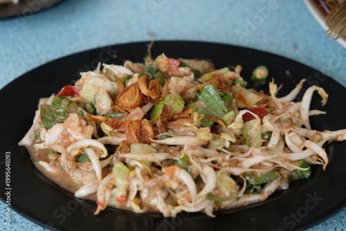 Karedok is a typical Sundanese, West Javanese raw vegetable dish, which is often referred to as a typical Indonesian salad because it consists of a mixture of fresh vegetables drizzled with sweet and 