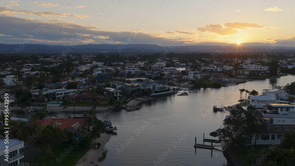 Fototapeta premium Aerial View of Gold Coast Canals and Residential Houses at Sunset