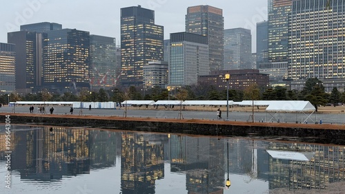 Tokyo Marunouchi skyline reflected in moat near the Imperial Palace, Tokyo, Japan