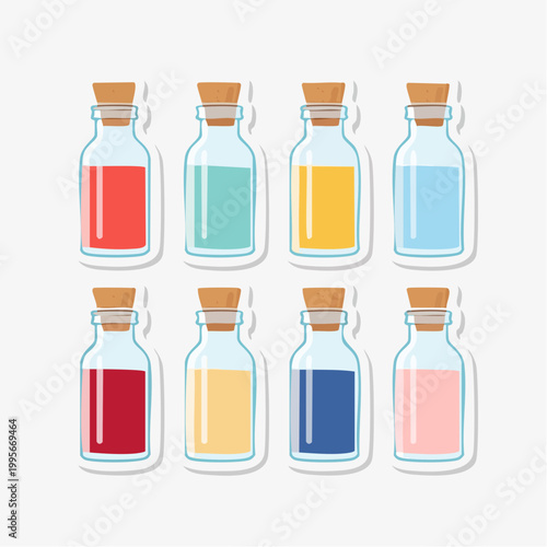 Collection of Small Glass Bottles with Cork Stoppers and Colored Liquids