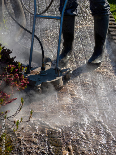 Hot Water Pressure Washer Cleaning Stone Patio Surface