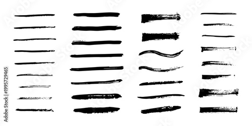A set of black ink brush strokes, hand drawn lines and blurs of varying thickness, isolated on a white background