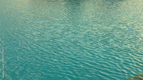 Tranquil Aquamarine Waters Shimmering Softly With Light Ripples And Peaceful Ambiance