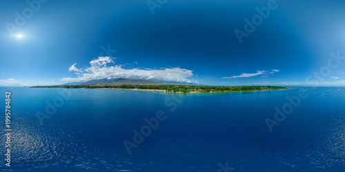 Aerial 360 degrees view of Issyk-Kul lake coastline with boats and calm water
