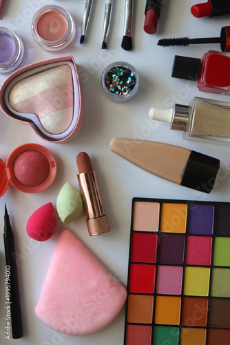 Various colorful cosmetic products on white background. Flat lay.