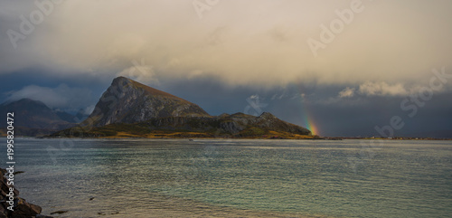 sunset and rainbow over the sea
