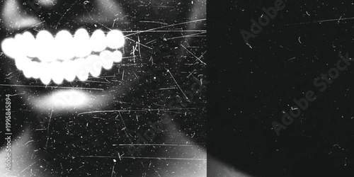 Grungy close up of a person smiling with glowing bright white teeth in a dark atmospheric setting